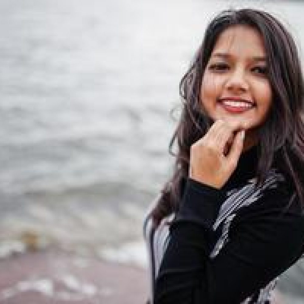 close-up-portrait-of-young-beautiful-indian-or-south-asian-teenage-girl-in-dress-photo